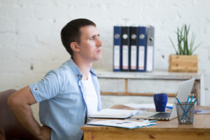 Workplace massage for employee wellbeing can help with back ache.